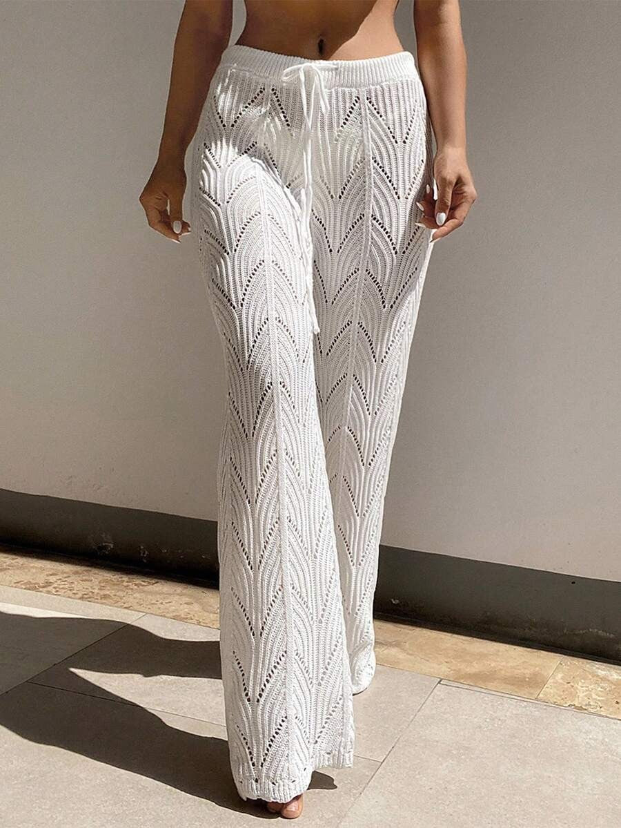 Beach pants with a drawstring woven waistband and small cutouts