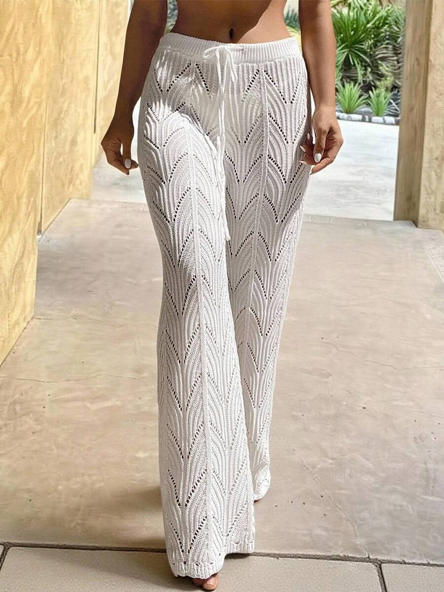 Beach pants with a drawstring woven waistband and small cutouts
