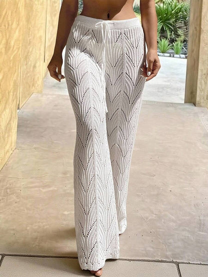 Beach pants with a drawstring woven waistband and small cutouts