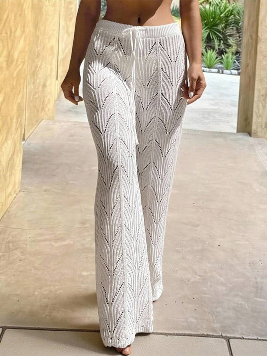 Beach pants with a drawstring woven waistband and small cutouts