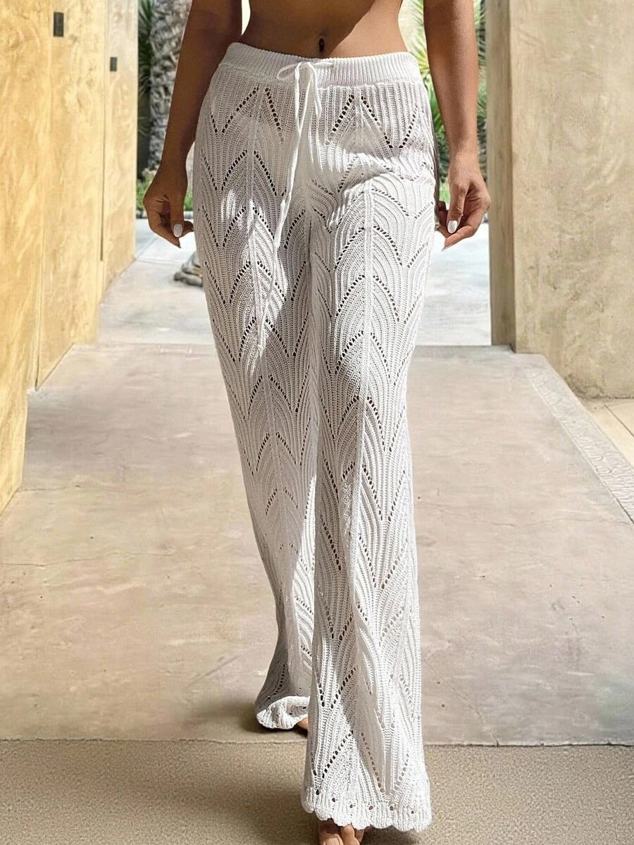 Beach pants with a drawstring woven waistband and small cutouts
