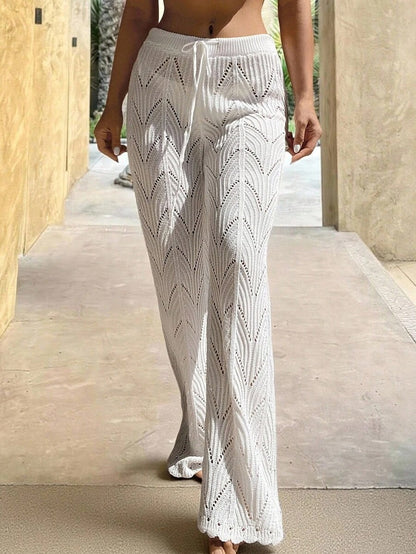 Beach pants with a drawstring woven waistband and small cutouts