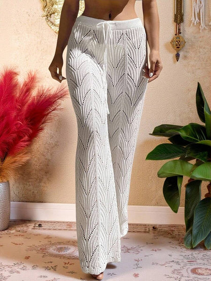 Beach pants with a drawstring woven waistband and small cutouts